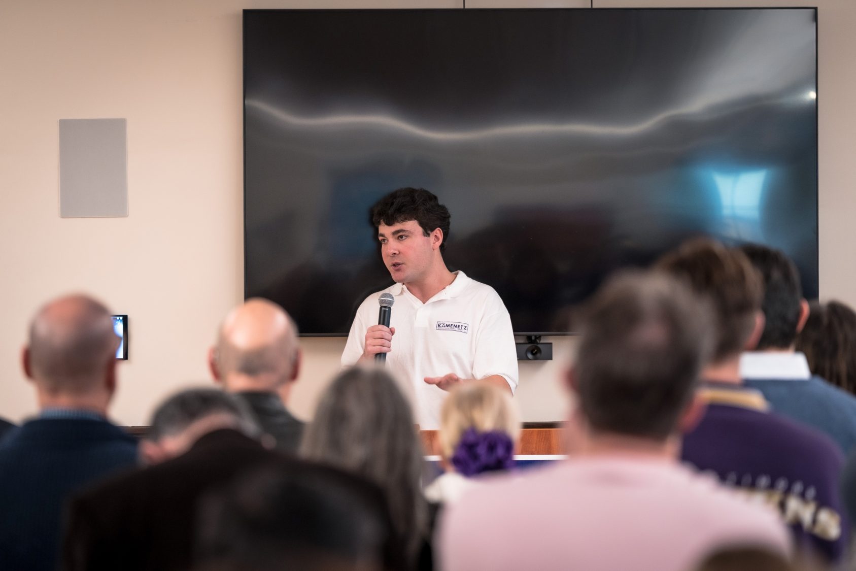 Karson speaking at a community event